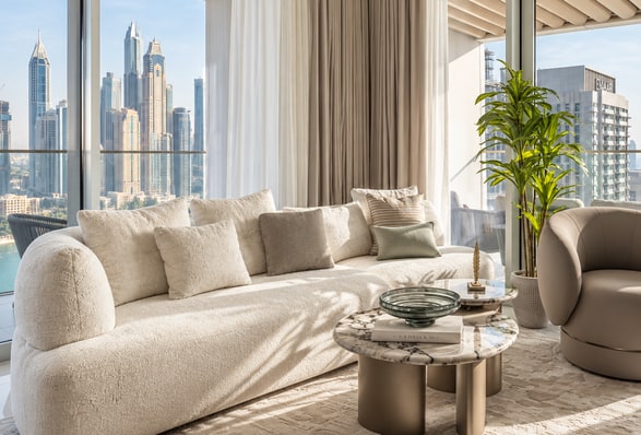 Soft cream seating with a view of the Dubai skyline